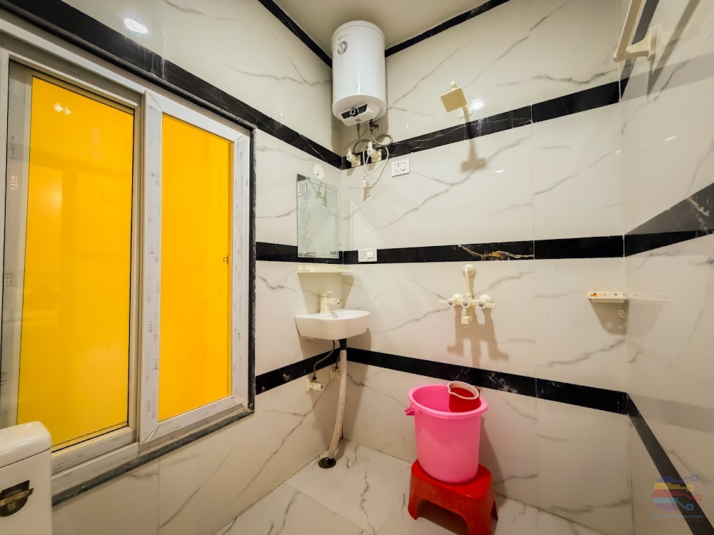Tiled Bathroom with Running Hot Water